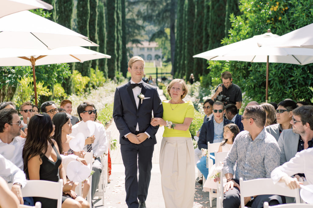 Groom walking down the aisle with mom at Villa Montalvo 